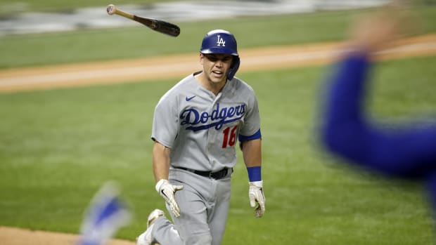 Oct 16, 2020; Arlington, Texas, USA; Los Angeles Dodgers catcher Will Smith (16) tosses his bat down the first baseline on his three run homerun against the Atlanta Braves during the sixth inning in game five of the 2020 NLCS at Globe Life Field. Mandatory Credit: Tim Heitman-USA TODAY Sports